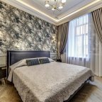 Кровать в номере Люкс с джакузи в отеле Премиум