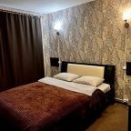 Кровать в номере Стандарт в отеле Lite на Косыгина