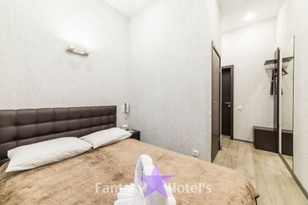 Большая кровать в номере Стандарт в отеле Фантазия в Купчино