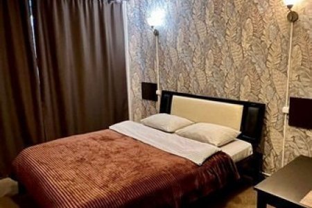 Кровать в номере Стандарт в гостинице Lite на Косыгина