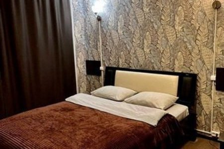 Кровать в номере Стандарт в отеле Lite на Косыгина